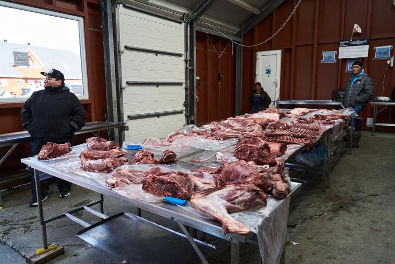 Hunters display their prey on the counter at the Nuuk market.
