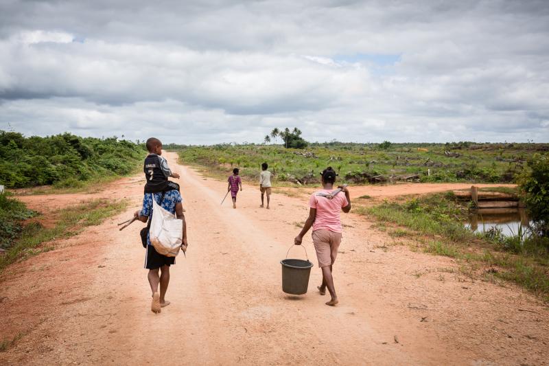 A family from the Auyu tribe in search for firewood. Photo by Albertus Vembrianto.