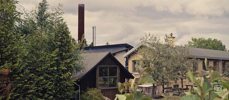 The factory chimney towers over the small town of Kvistgård.