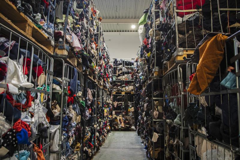 Tons of second-hand clothing in a processing facility